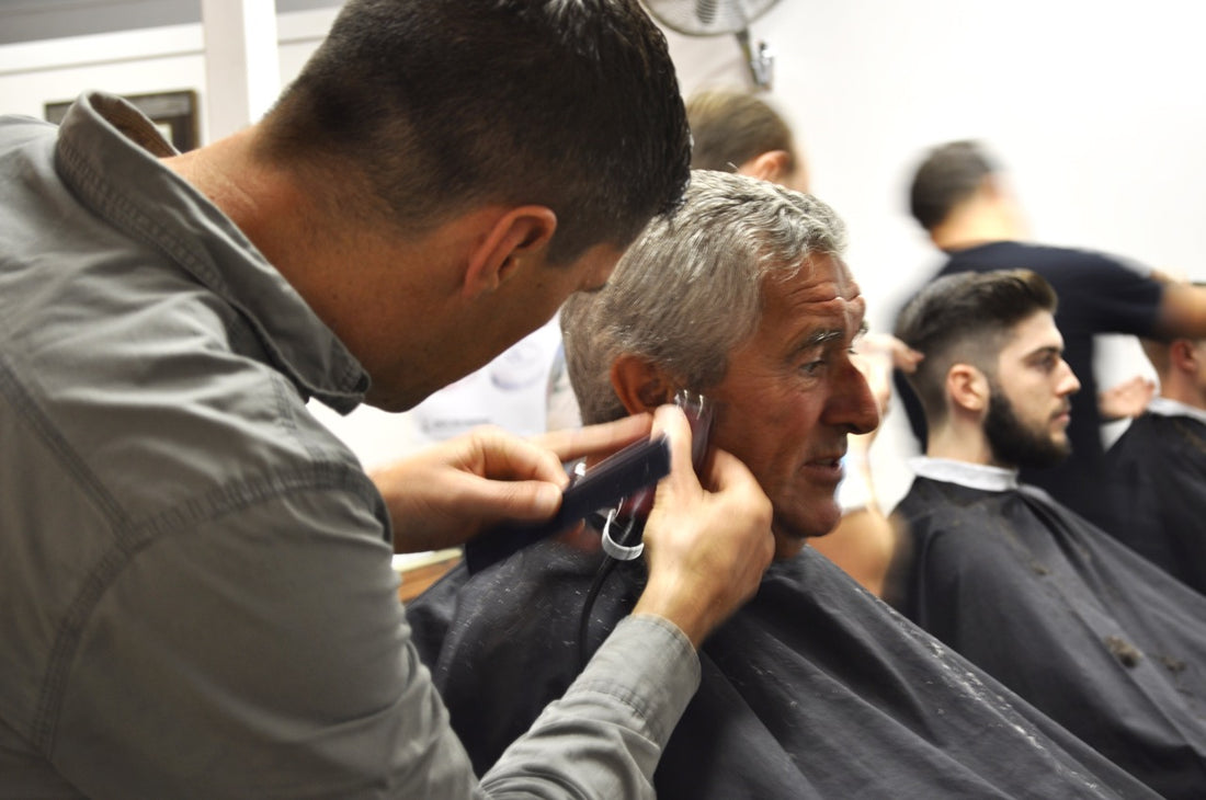 Paul Macnamara cutting his dads hair barber shop byron bay jack the snipper